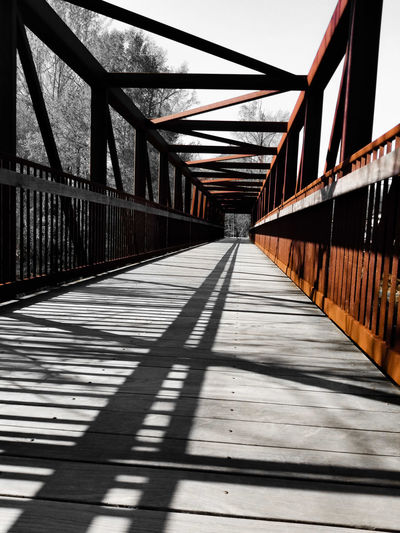Empty footbridge along footpath