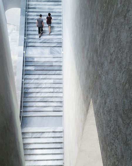 High angle view of couple on staircase at kunstmuseum basel