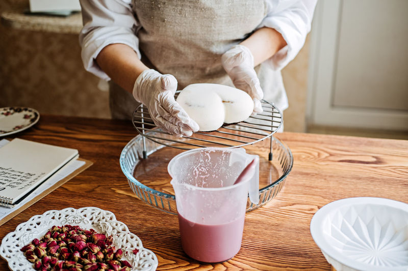 Confectioner small business, arabic confectioner chef make heart shape mirror glaze mousse cake