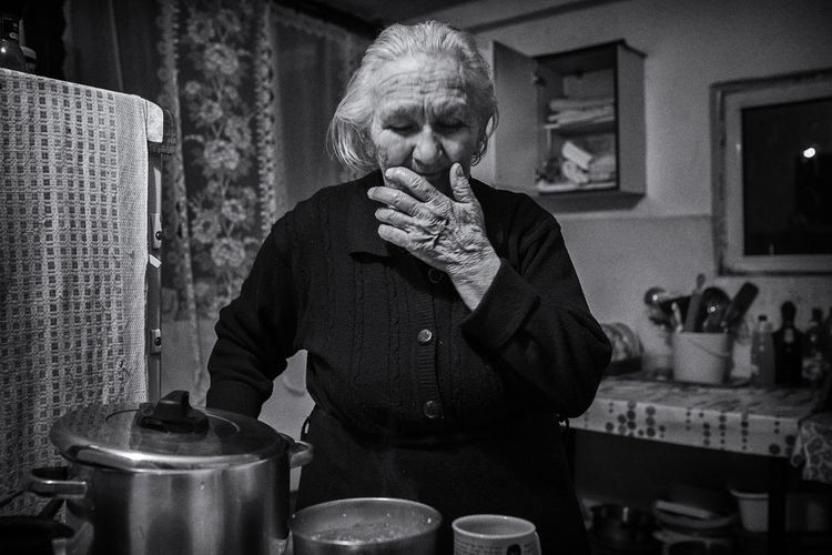 Senior woman preparing food at home