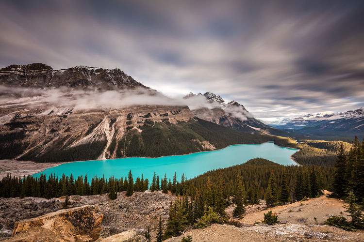 Dramatic sky and turquoise water at peyto lake in banff national park