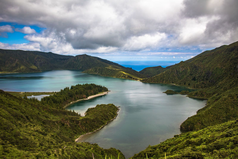 Scenic view of lake and mountains against sky