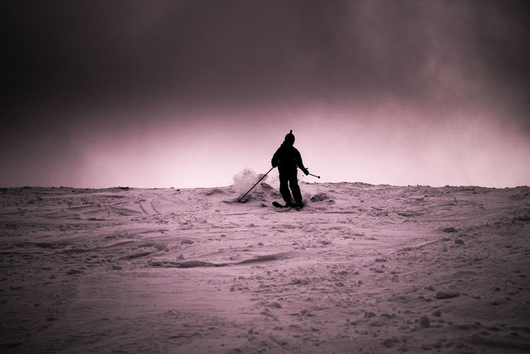 Person skiing on snowy field