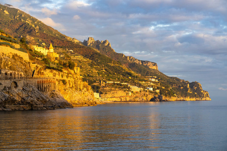 Scenic sunset over amalfi coast viewed from the town of minori, campania, italy