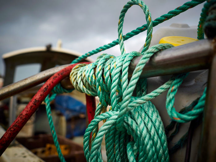 Close-up of rope tied to fishing boat