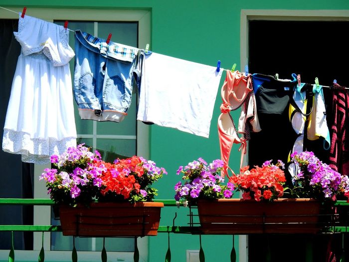Clothesline and flower basket at balcony