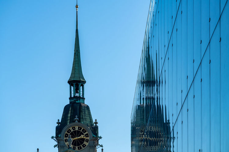 Low angle view of buildings against blue sky