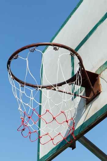 Low angle view of basketball hoop against clear sky