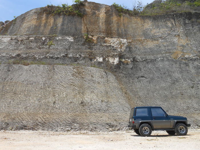 Car parked on rock