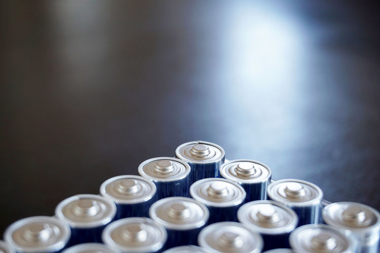 Close-up of blue batteries on table