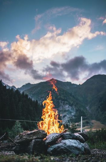 Campfire on ground against sky