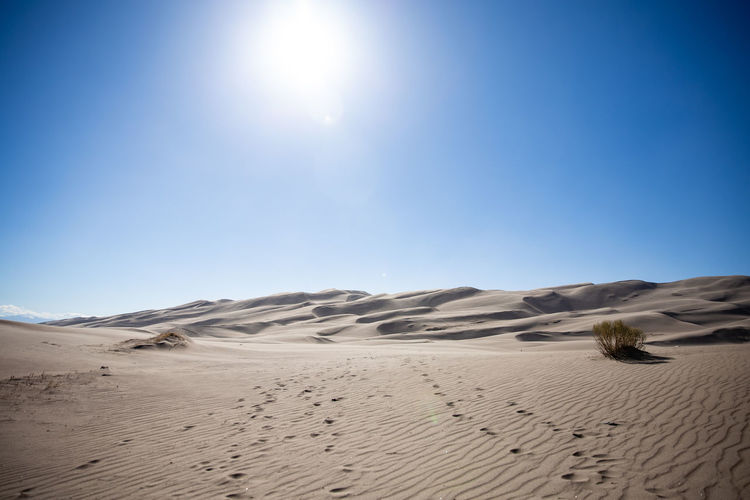 Scenic view of desert against clear sky