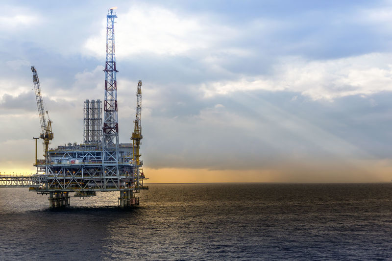 An oil production platform for enhance oil recovery program during sunrise at offshore oil field