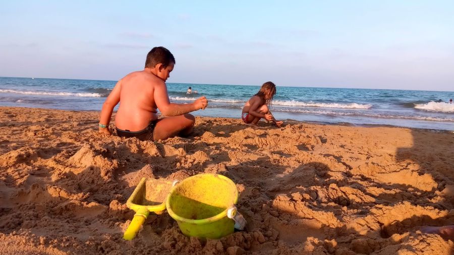 Children playing at sandy beach