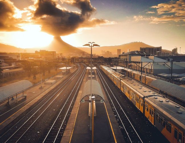 High angle view of railway tracks against sky at sunset