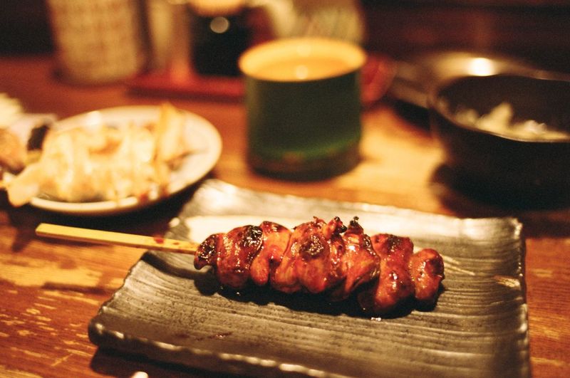Close-up of fresh yakitori served in plate on table