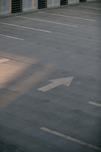 High angle view of arrow sign on road