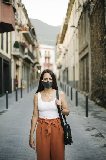 Woman wearing mask in town