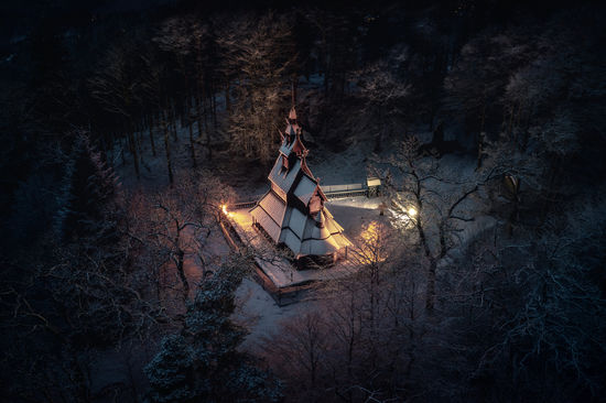 Fantoft stave church in bergen during the winter night.