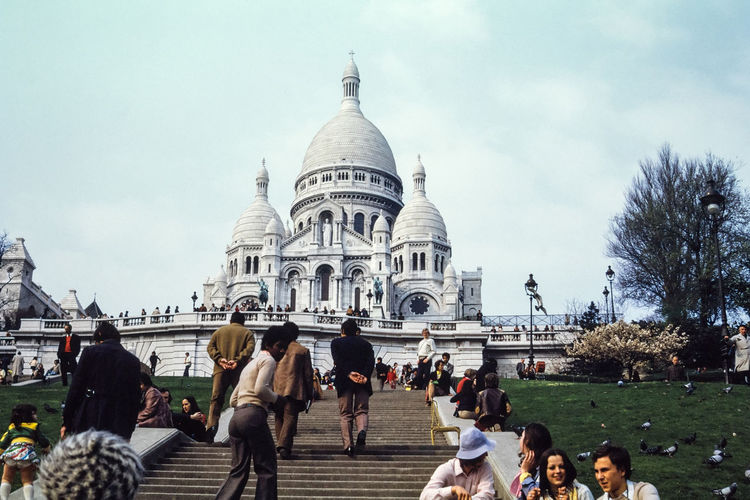 Low angle view of tourists at basilique du sacre coeur