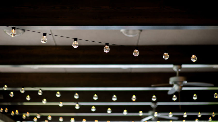 Retro light bulbs hanging in department store, with decorate interior luxury