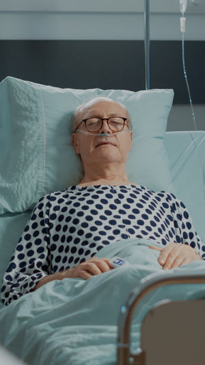 Portrait of man relaxing on bed