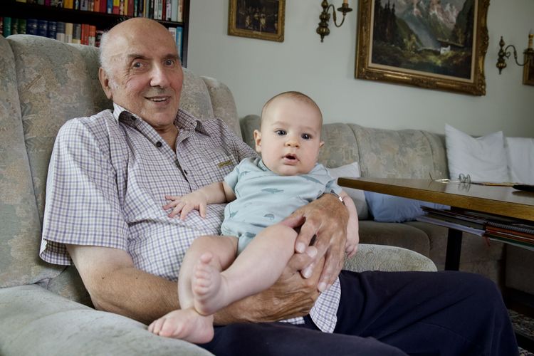 Grandfather and cute grandchild at home