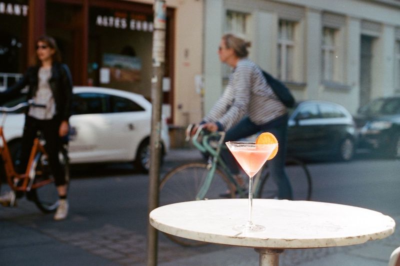 Martini cocktail on table at street