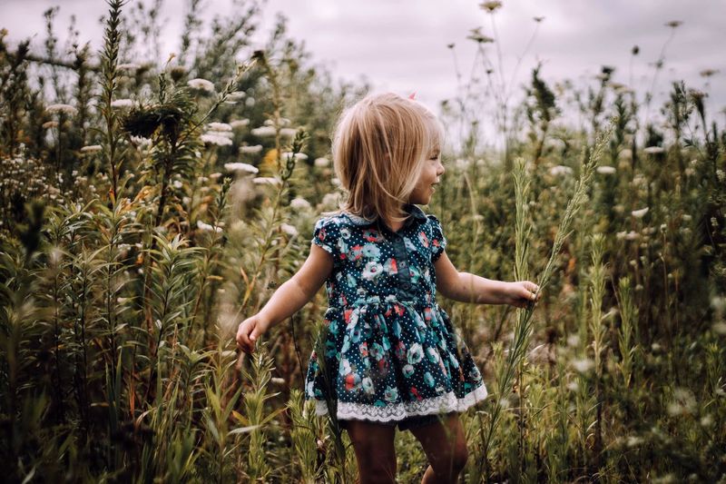 Girl standing on field