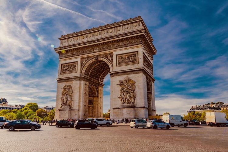 Low angle view of arc de triomphe in city