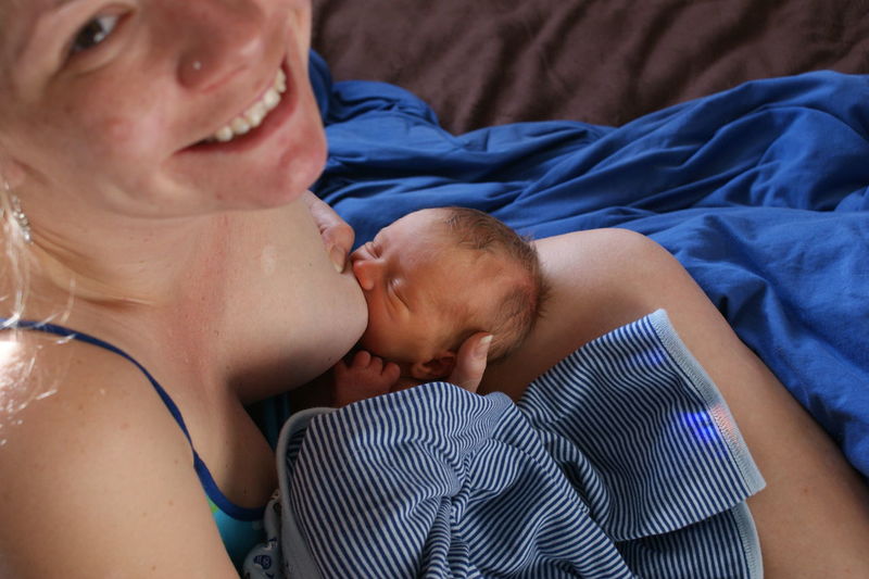 Portrait of woman breastfeeding baby