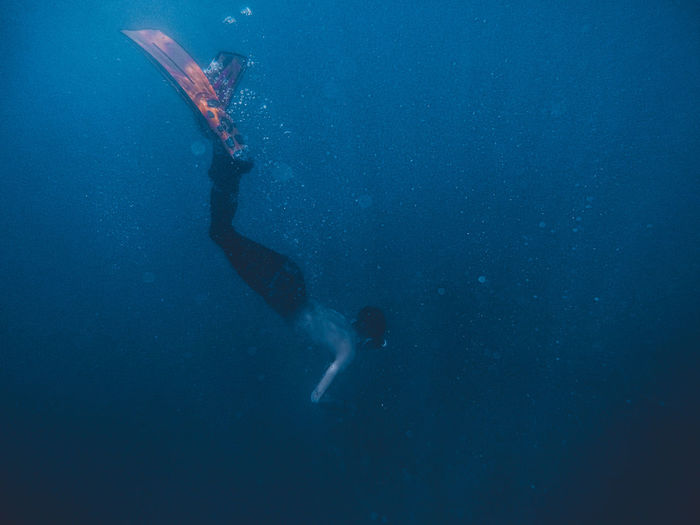 Full length of man diving undersea