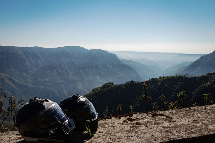 Helmet at mountain top with misty mountain background