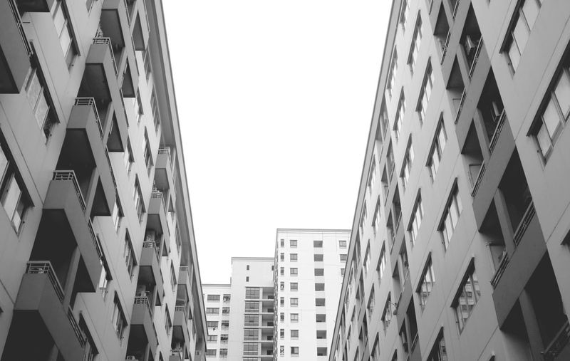 Low angle view of modern architecture in monochrome