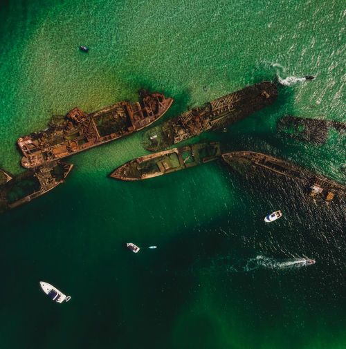 Top view drone aerial of shipwrecks in turquoise waters