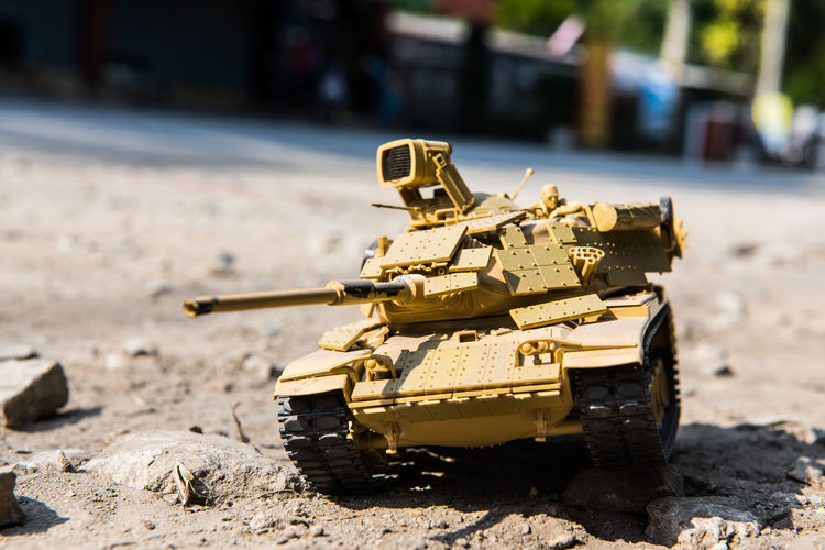 Close-up of toy army vehicle on land