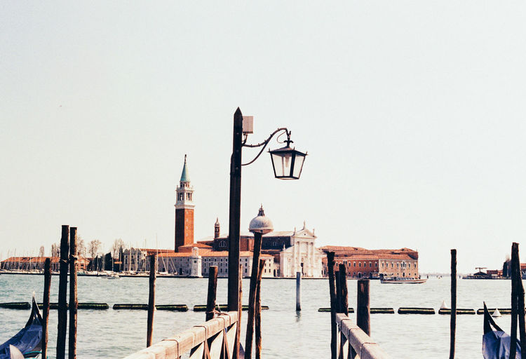 Wooden post in grand canal against church of san giorgio maggiore