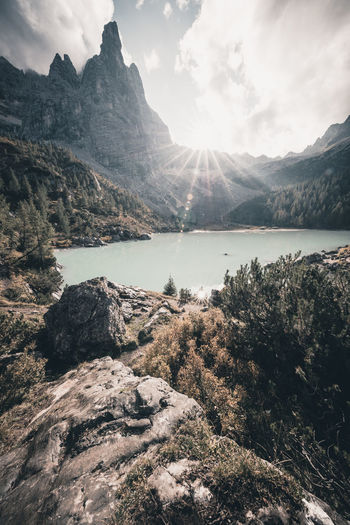 View of lake and mountains against sky