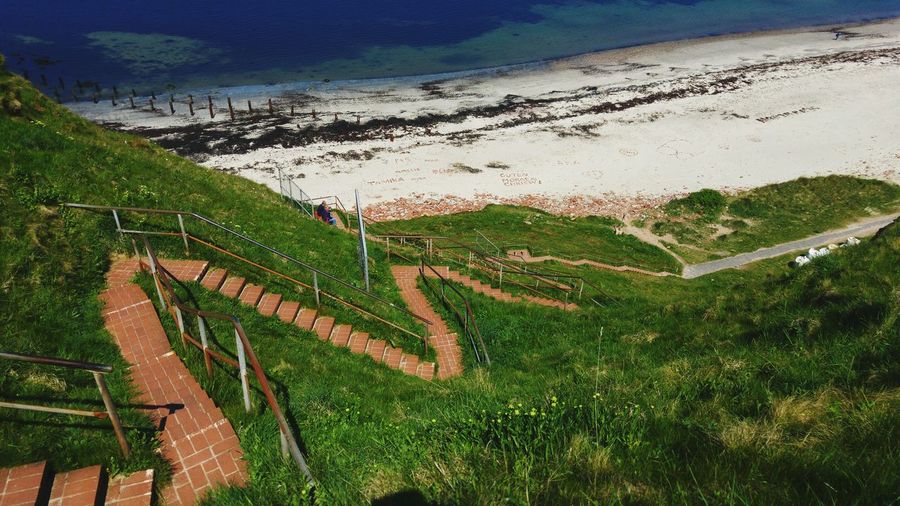 High angle view of stairs on landscape against sky