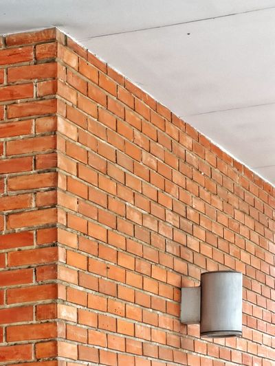 Low angle view of brick wall on building