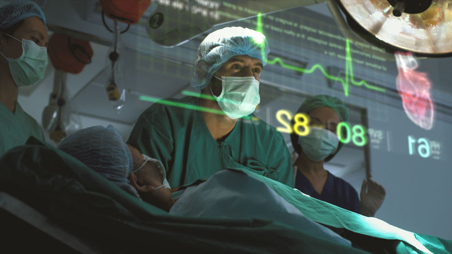 Low angle view of doctor examining patient in hospital