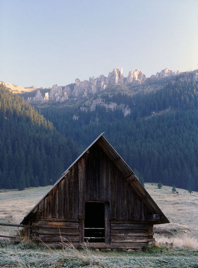 Log cabin in winter landscape