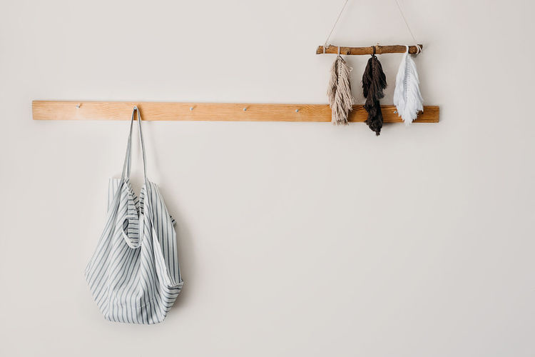 Clothes hanging on wall at home