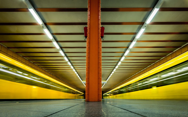 Speeding blurred trains at underground railway station