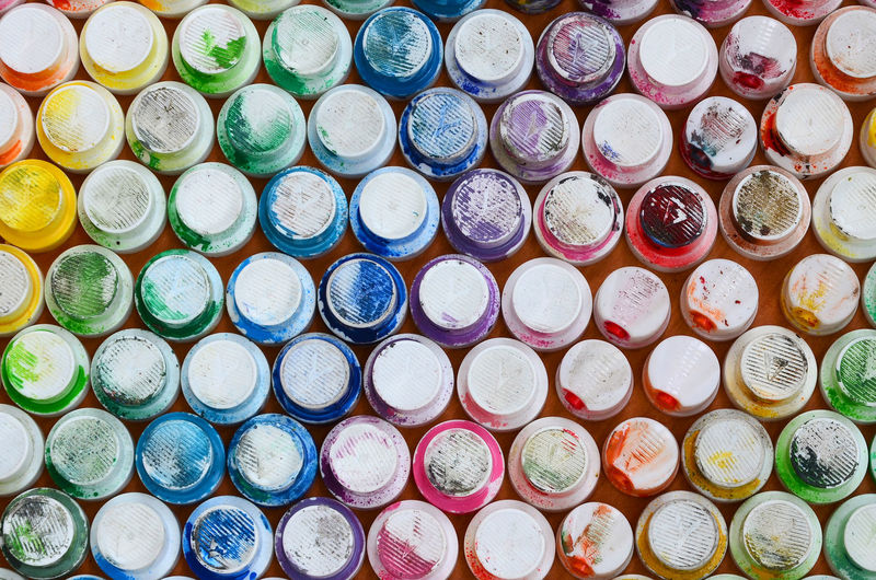 Full frame shot of colorful spray cans