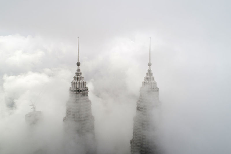 Skyscraper amidst clouds