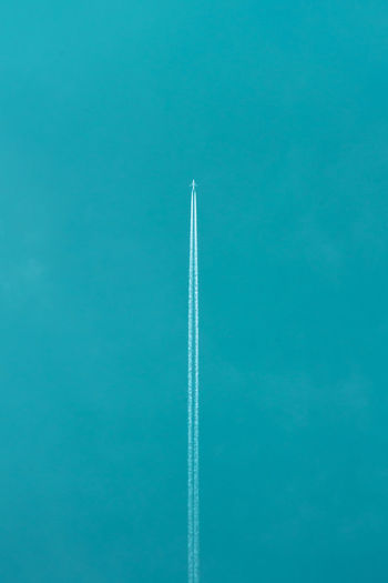Airplane flying against clear blue sky