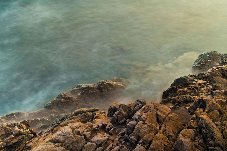 Scenic view of rocks in sea