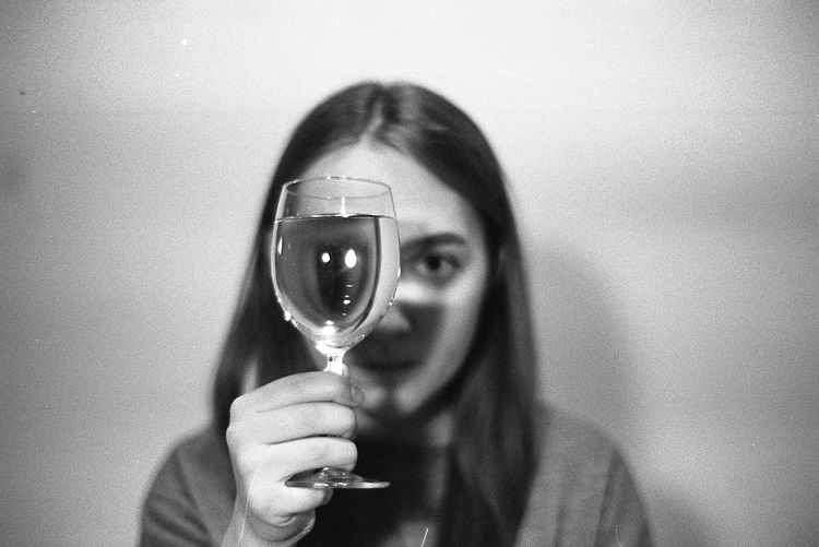 Close-up of woman holding wineglass
