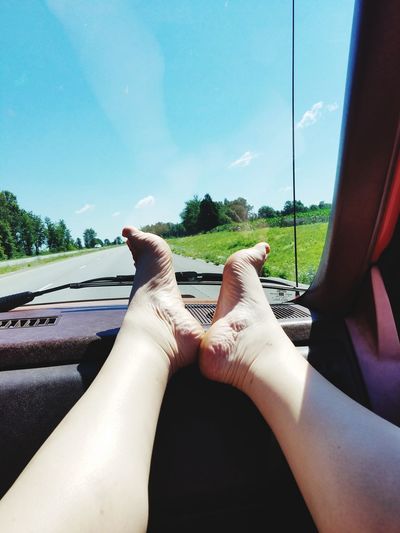 Low section of person sitting in car